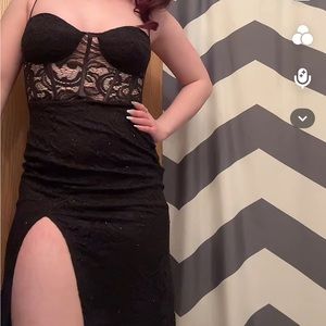 Gorgeous black dress with leg slit and cute design. Was only worn once for prom!